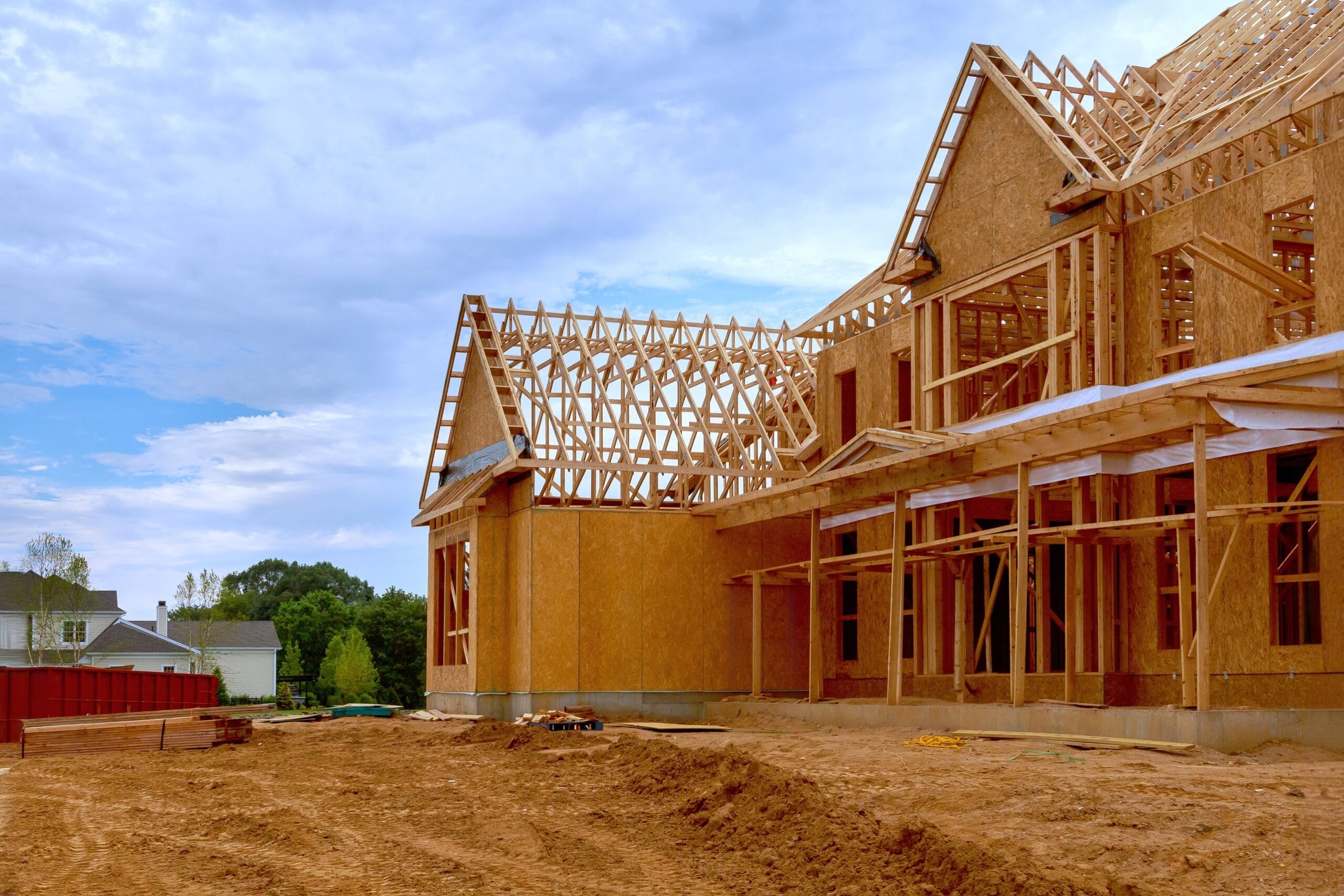 Wooden-framed house under construction in Los Angeles, California, illustrating the early stages of rebuilding after wildfires.